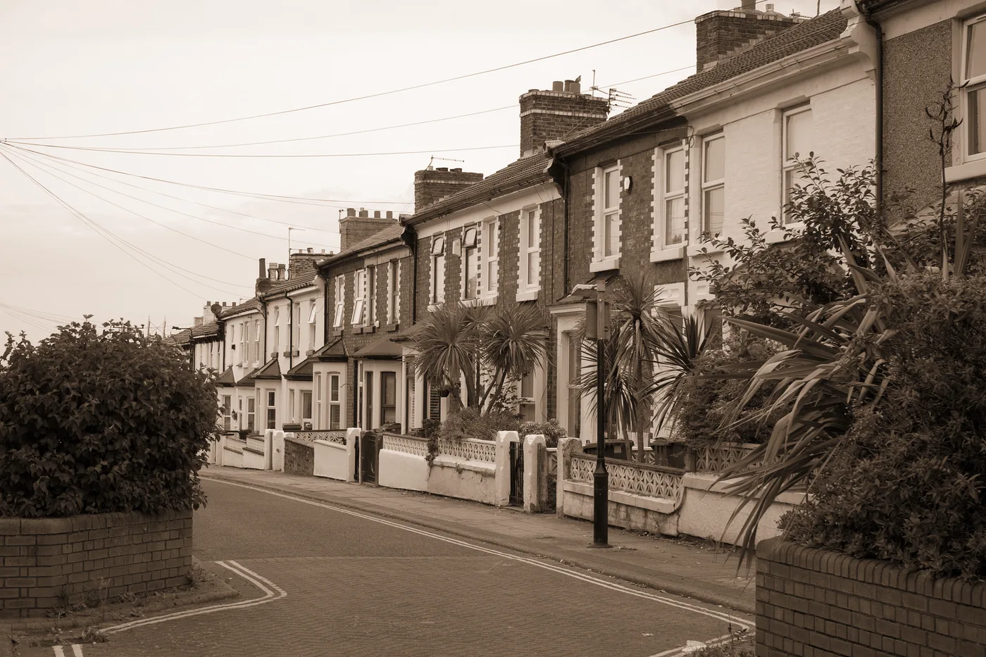 A row of bay-fronted terraced houses, graded at a third of full colour